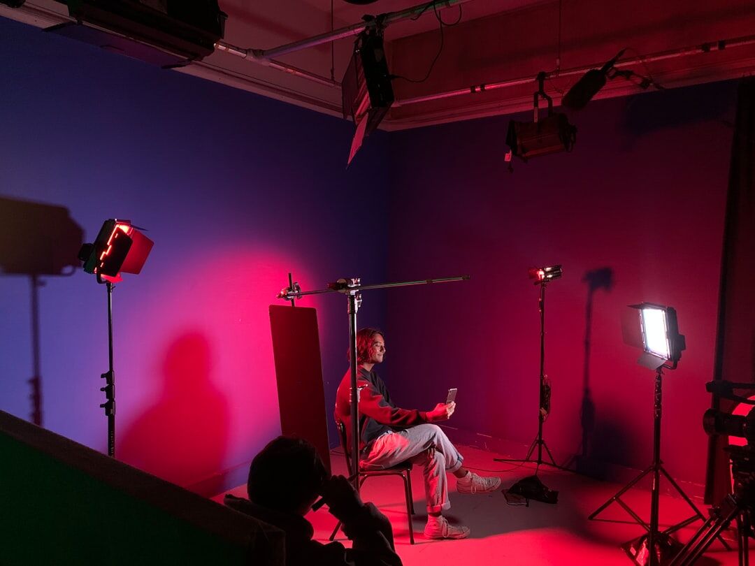 Professional broadcasting studio with cameras and dramatic lighting