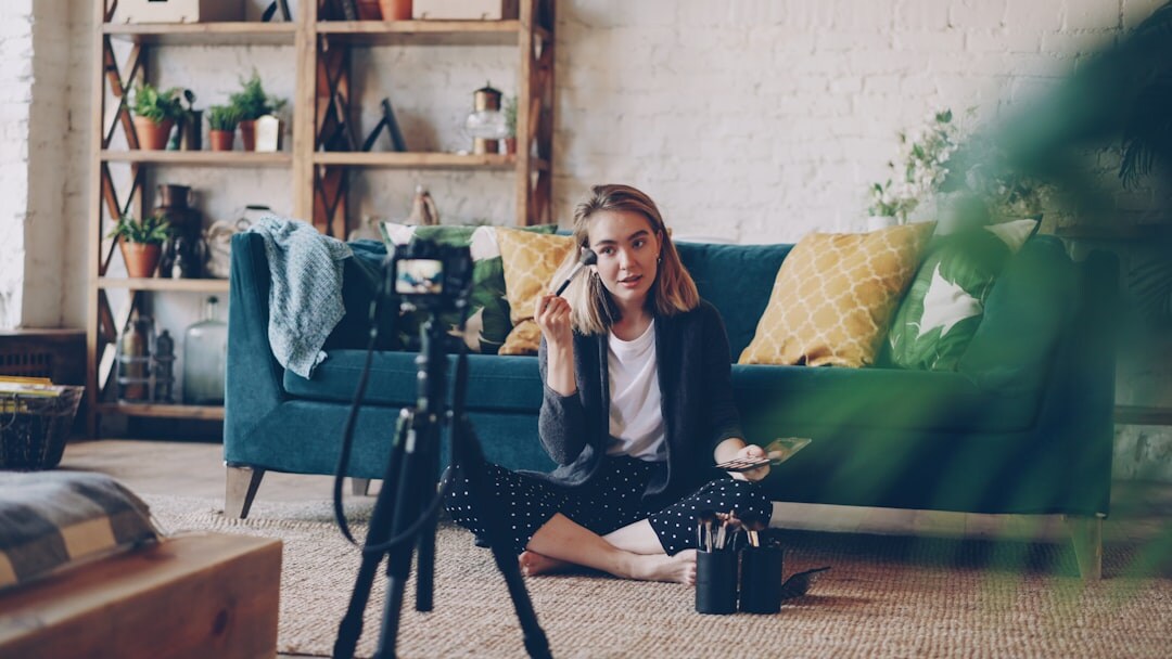 Professional videographer setting up a cinema camera in a modern studio